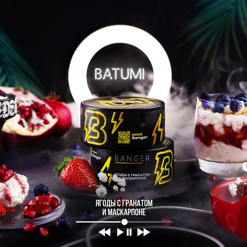LE TABAC Banger Batumi shisha tobacco with berries and pomegranate flavor in black packaging surrounded by fresh fruit and dessert
