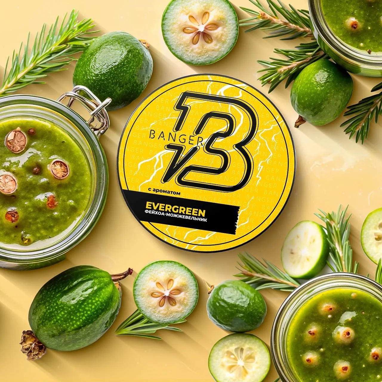 LE TABAC Banger V3 Evergreen hookah flavor container surrounded by fresh feijoa fruits and greenery