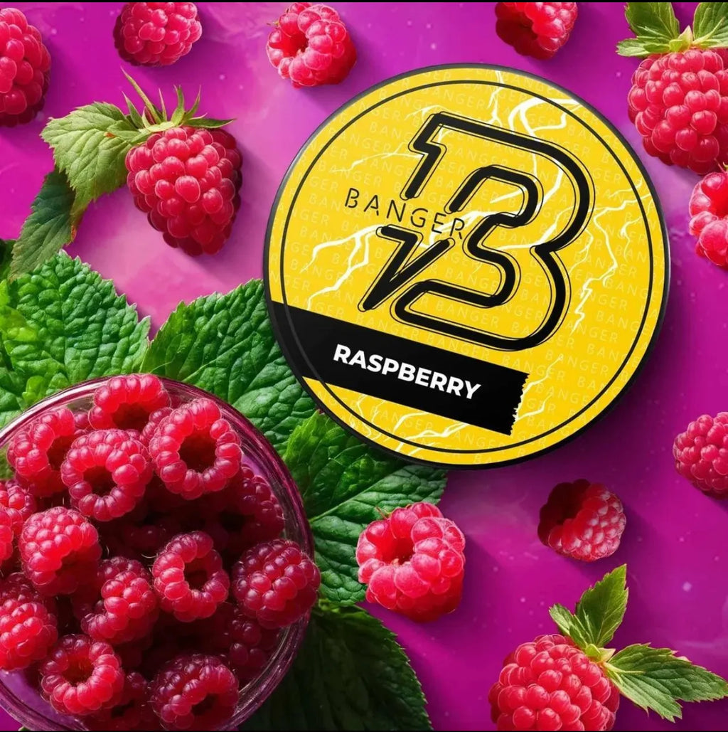 LE TABAC Banger V3 Raspberry flavored product surrounded by fresh raspberries and green leaves