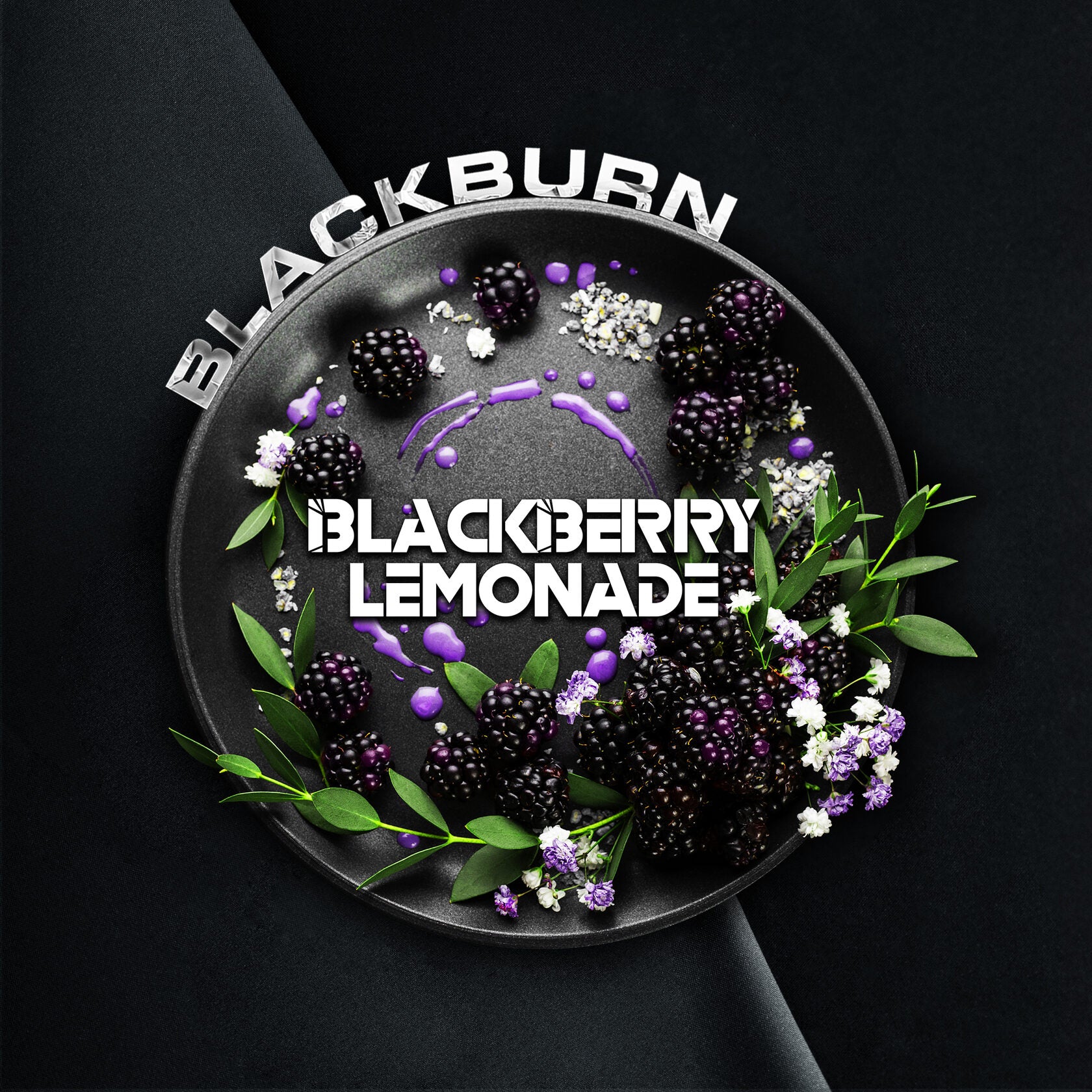 Blackberry lemonade plate with fresh blackberries, purple sauce, green leaves, and white flowers on black background