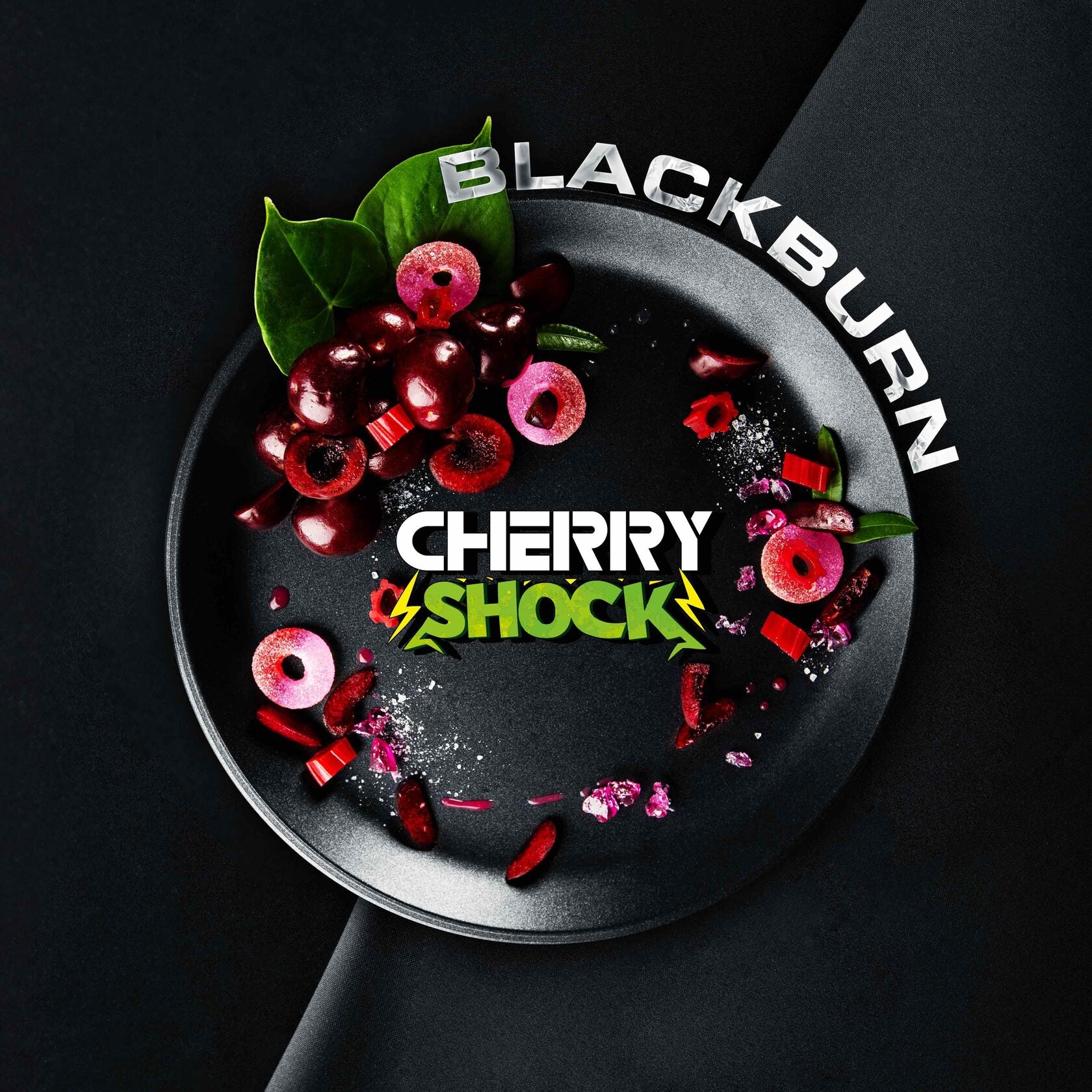 Blackburn Cherry Shock product display with fresh cherries and pink cherry candies on a black plate