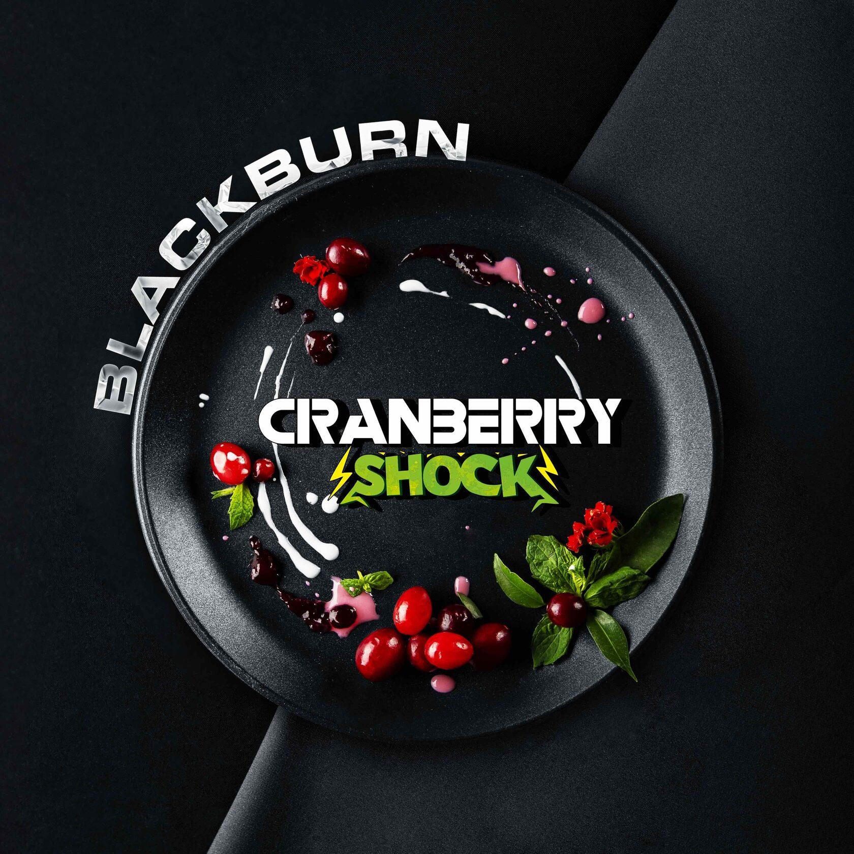Blackburn Cranberry Shock beverage with fresh cranberries and green leaves on black plate
