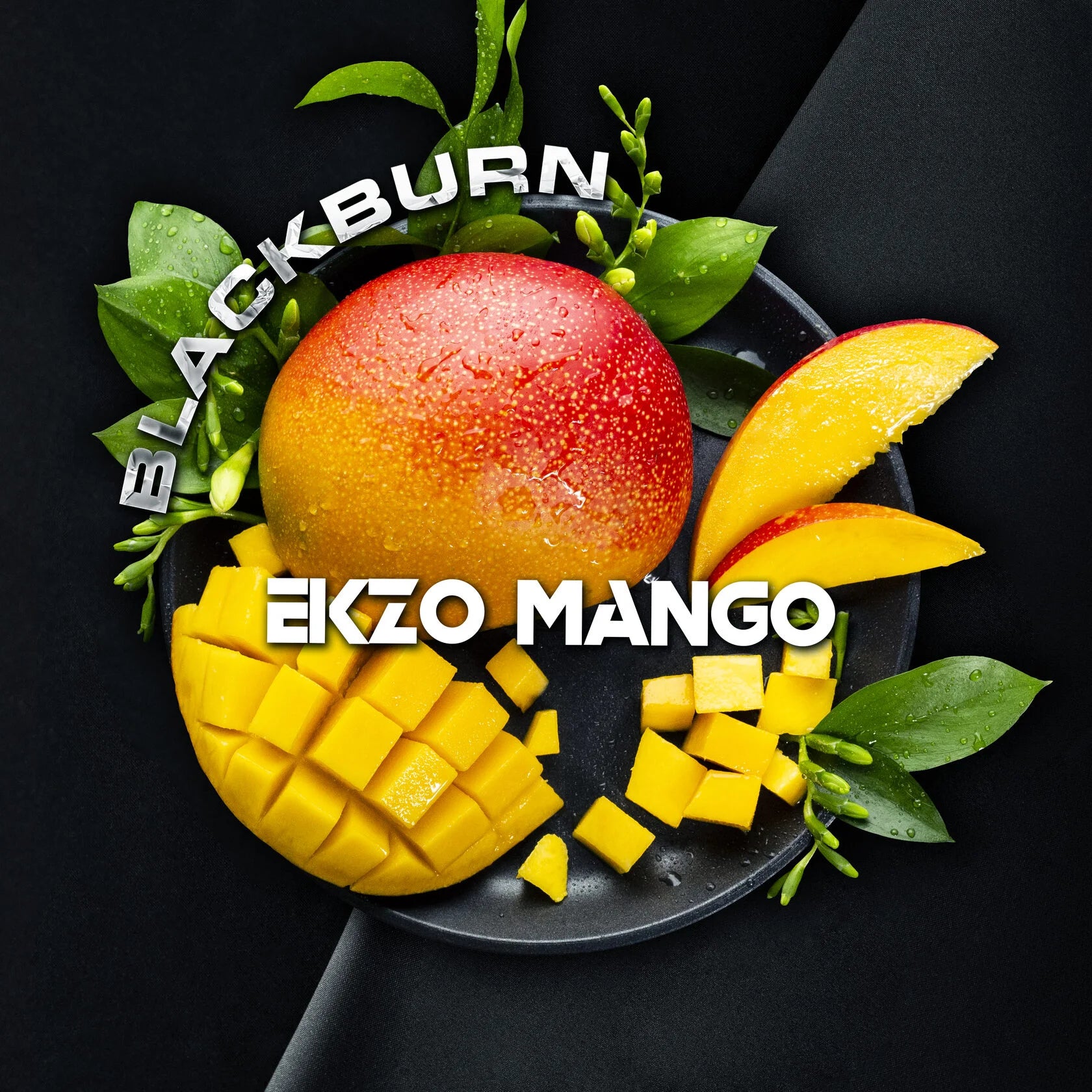 Blackburn Ekzo Mango with whole and diced fresh mango pieces and green leaves on a black plate