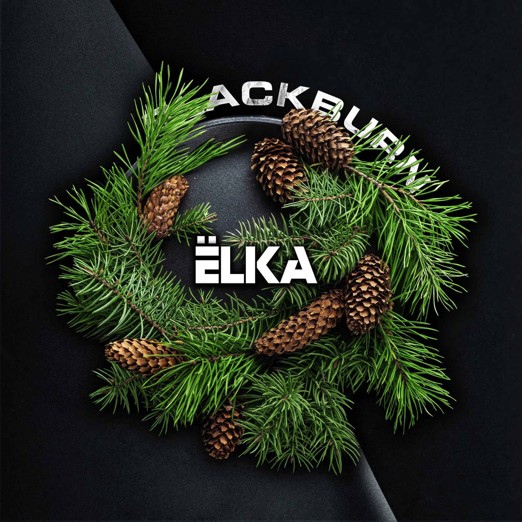 Pine wreath with pine cones on black background featuring LE TABAC branding