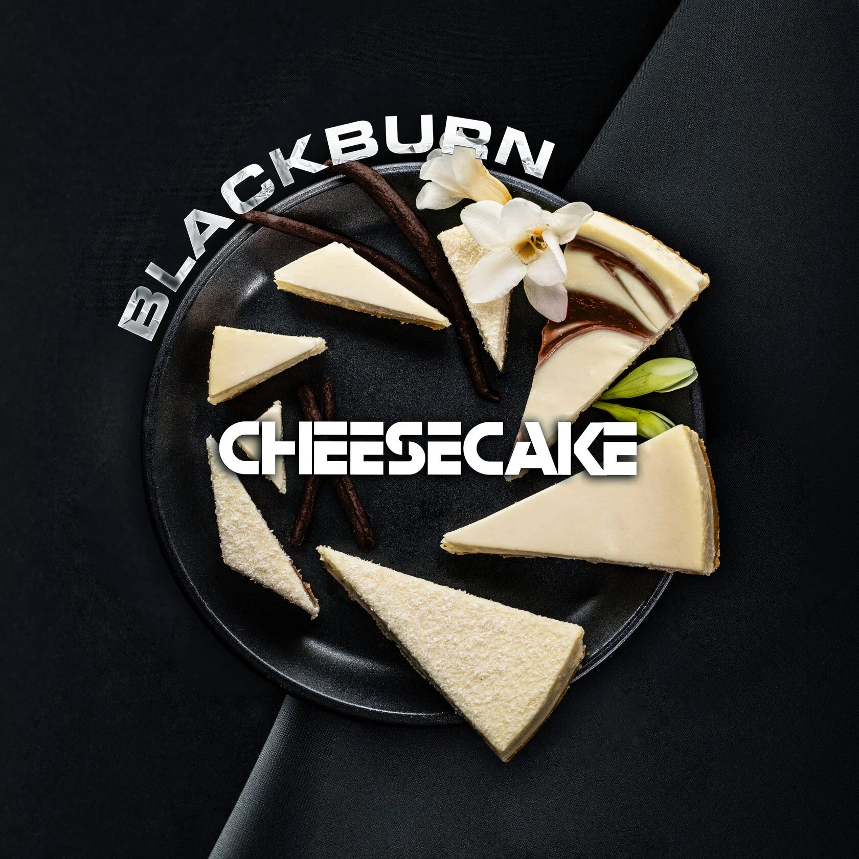 Blackburn cheesecake slices arranged on a black plate with vanilla pods and white flowers