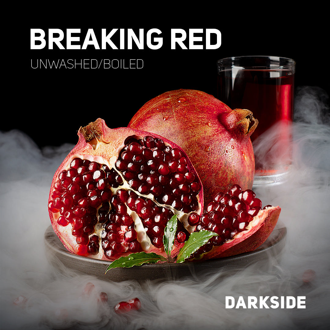 Darkside Breaking Red flavored tobacco with pomegranate fruit and a glass of red liquid on a smoky background