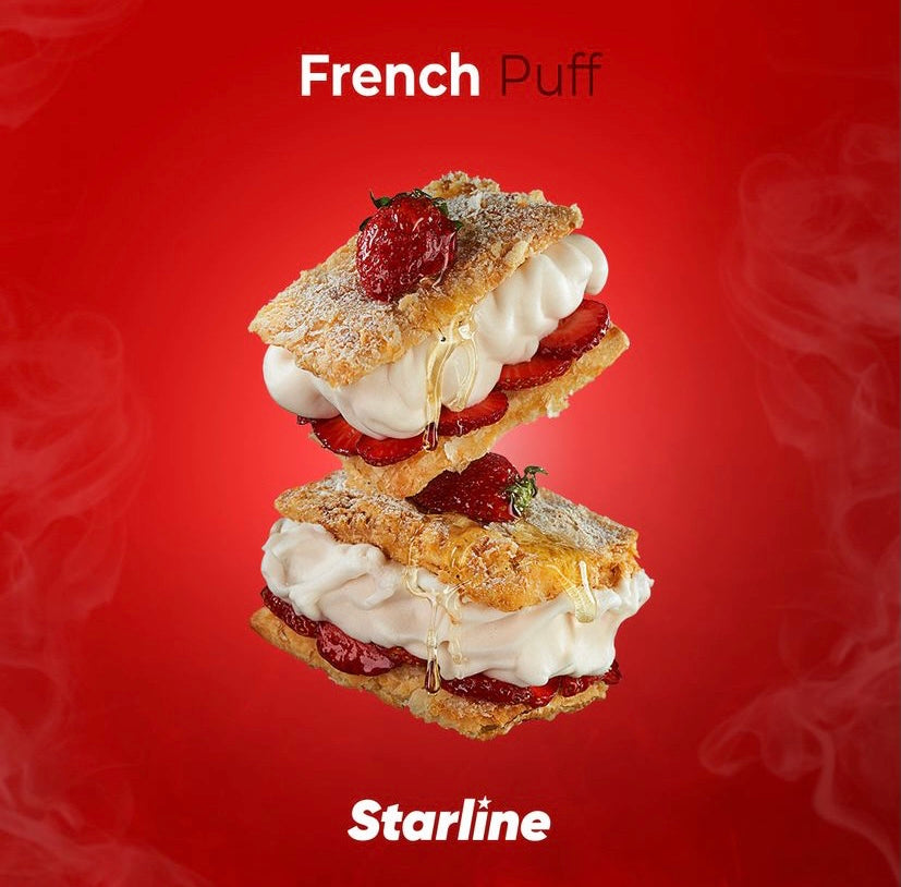 French Puff dessert with layers of puff pastry, whipped cream, and fresh strawberries on red background